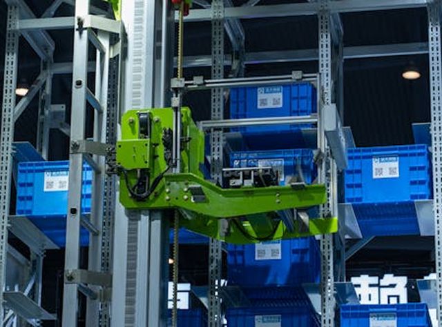 A Forklift Elevates Boxes Into A Warehouse